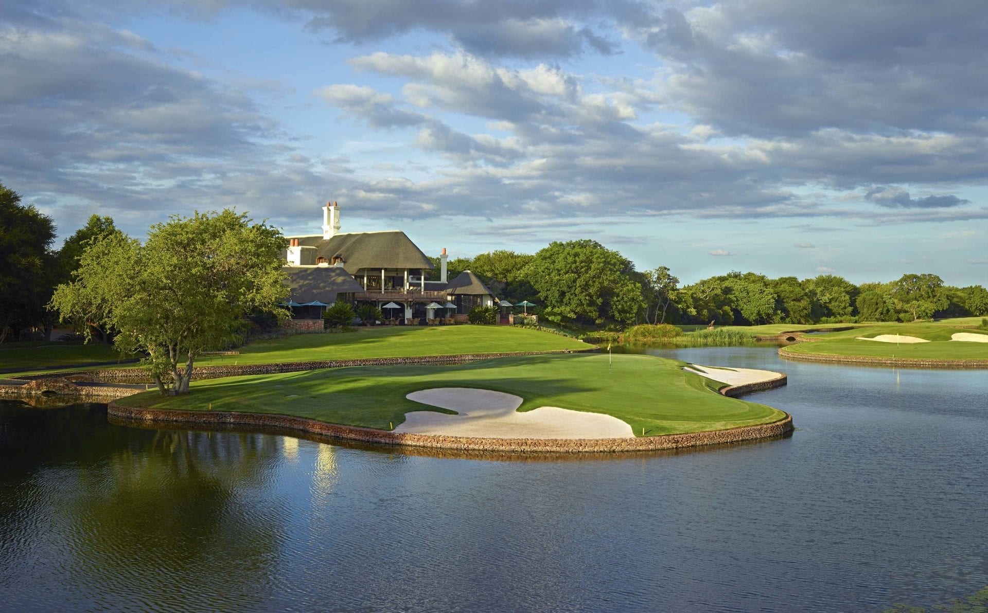 Leopard Creek 13th green high above the Crocodile River, Kruger beyond