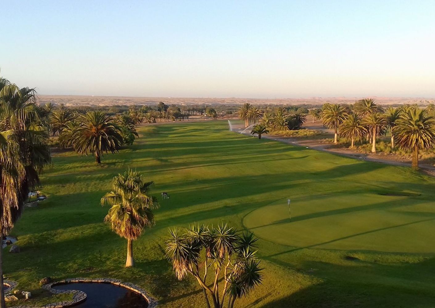 Emerald fairway against red Namib sand, Rossmund